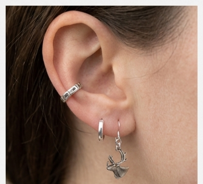 model wearing hand cut coin earrings