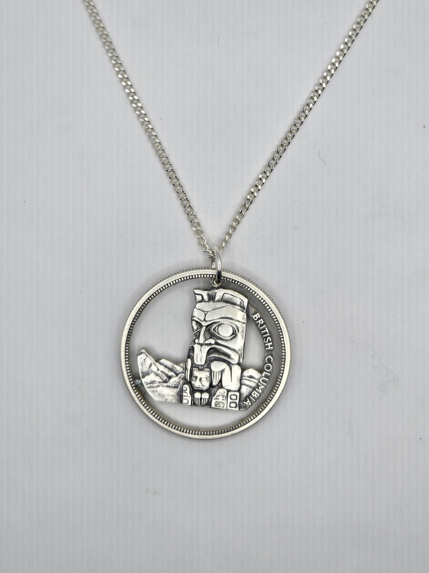 Hand Pierced 1958 BC Centennial Silver Dollar