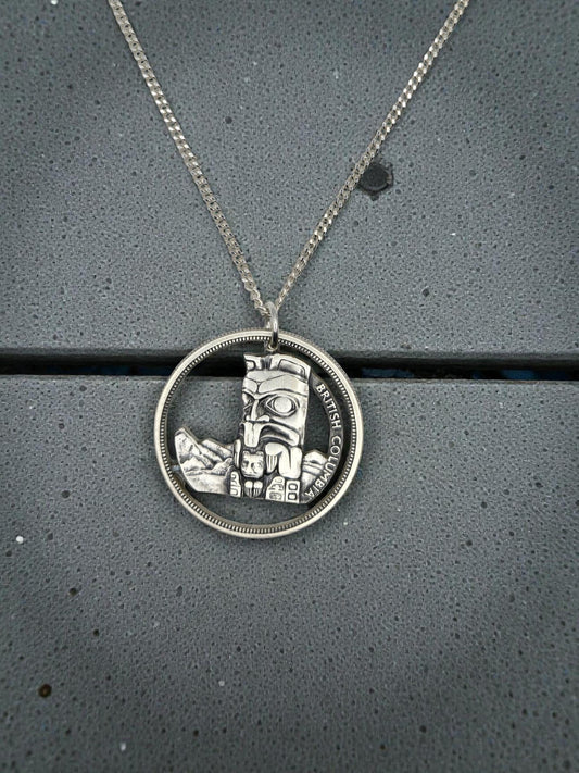 Hand Pierced 1958 BC Centennial Silver Dollar