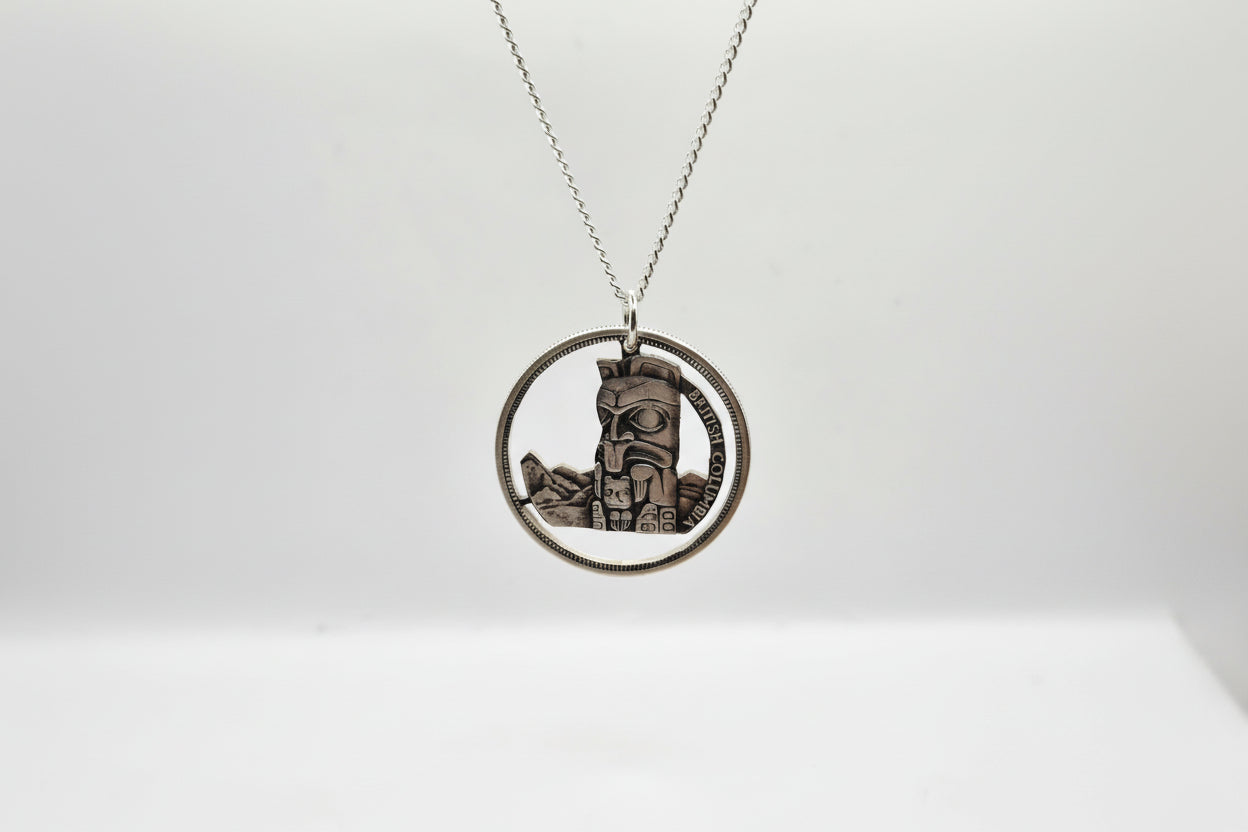 Hand Pierced 1958 BC Centennial Silver Dollar