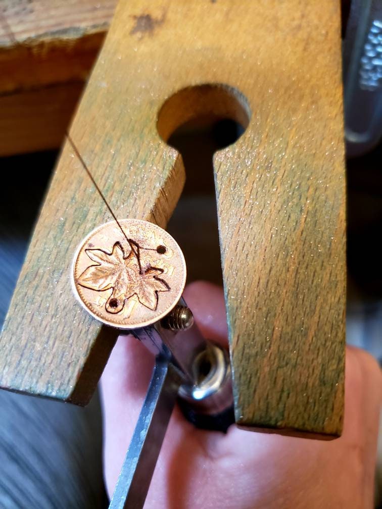 Hand Carved Canadian Pennies
